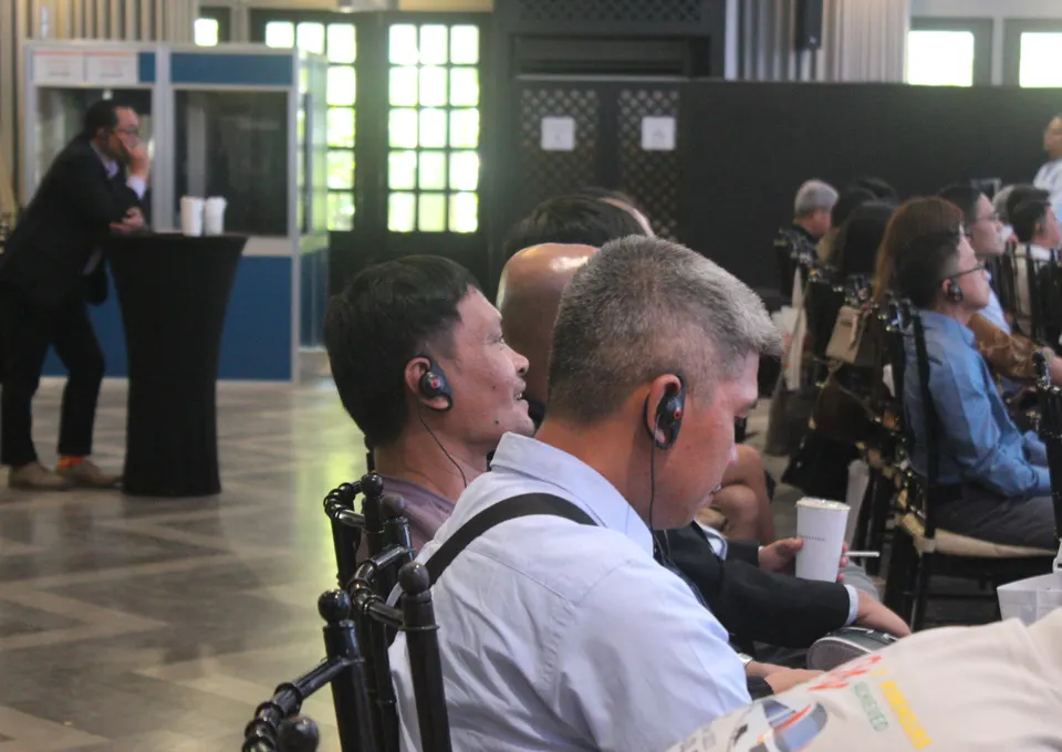 Conference audience using interpretation earpieces
